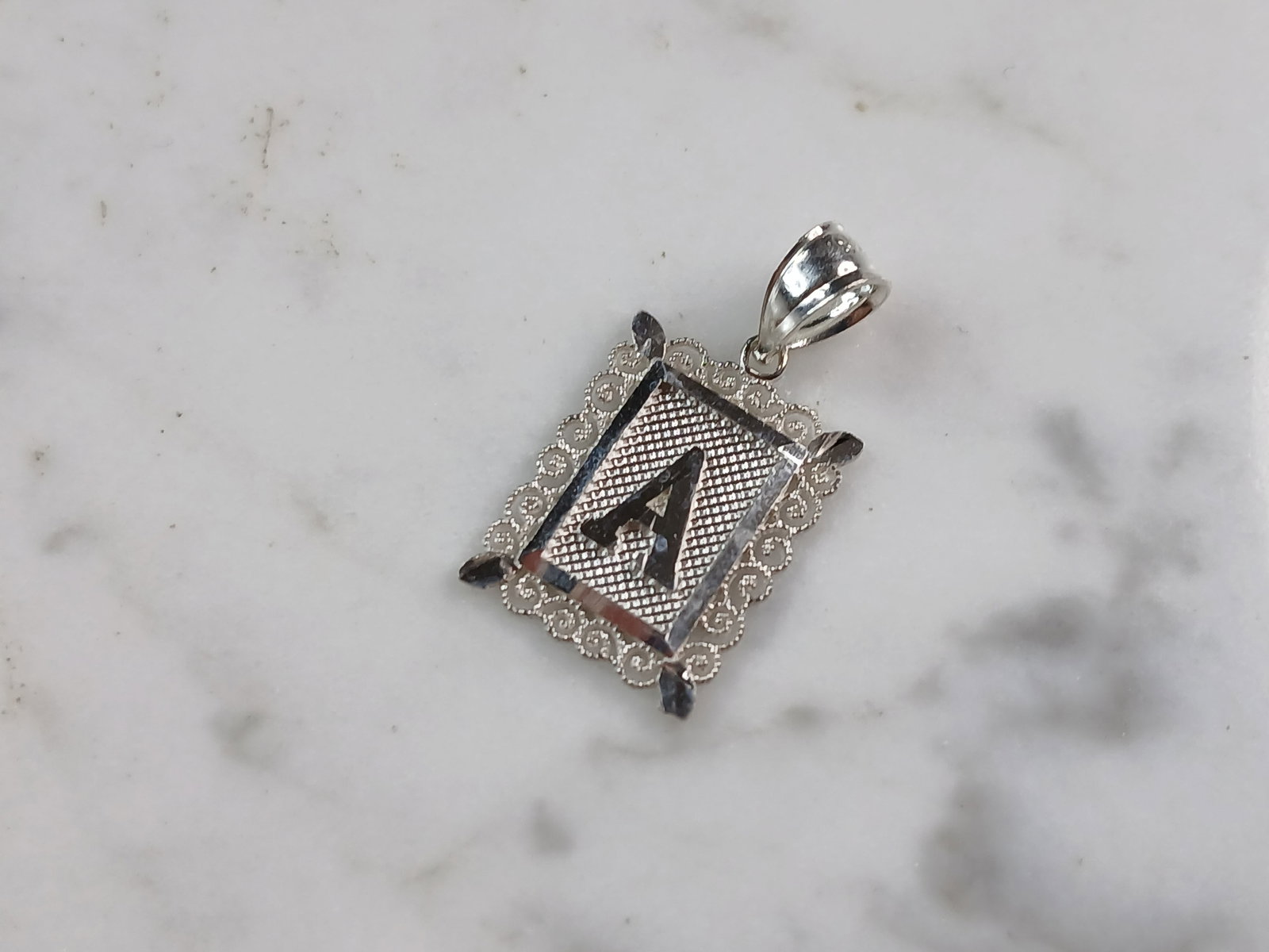 Womens Sterling Silver Initial Letter " A " Pendant: A WOMENS STERLING SILVER INITIAL LETTER "A" PENDANT. PENDANT WEIGHS 1.0g AND MEASURES 7/8" LONG BY 1/2" WIDE. MAKES A GREAT GIFT FOR THAT SOMEONE SPECIAL. ANY QUESTIONS, PLEASE ASK. BE SURE TO CHECK O