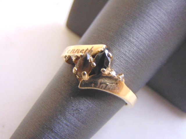 Womens 14k Yellow Gold Sapphire & Smoky Quartz Ring: FOR SALE IS THIS LOVELY VINTAGE ESTATE 14K GOLD RING WITH WHAT APPEARS TO BE A BLUE SAPPHIRE AND A SMOKY QUARTZ STONE. RING IS A SIZE 7.75 AND WEIGHS 3.9g. RING DOES HAVE TWO NAMES ETCHED ON THE FRONT