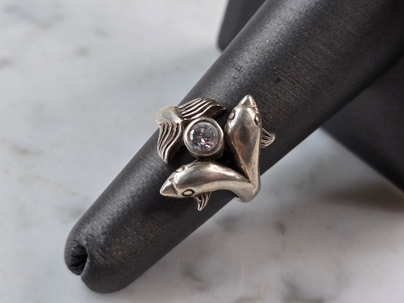 Womens Vintage Estate Sterling Silver Dolphin Ring: A WOMENS VINTAGE ESTATE STERLING SILVER DOLPHIN RING . THE RING WEIGHS 4.7g, AND IS A SIZE 5.25. THE WIDTH OF THE RING IS 3/4". ANY QUESTIONS PLEASE DO NOT HESITATE TO ASK. BE SURE TO CHECK OUT SOME O
