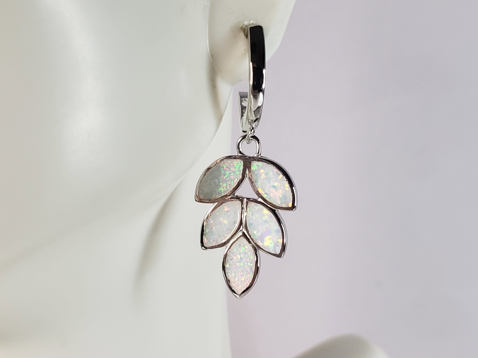 Womens Estate Sterling Silver Opal Leaf Earrings: A PAIR OF WOMENS STERLING SILVER OPAL COLORED LEAF EARRINGS THAT WEIGH 4.3g AND MEASURES 1 3/8" LONG BY 1/2" WIDE. NOT SURE IF STONES ARE REAL OR MAN MADE. ANY QUESTIONS, PLEASE DO NOT HESITATE TO ASK