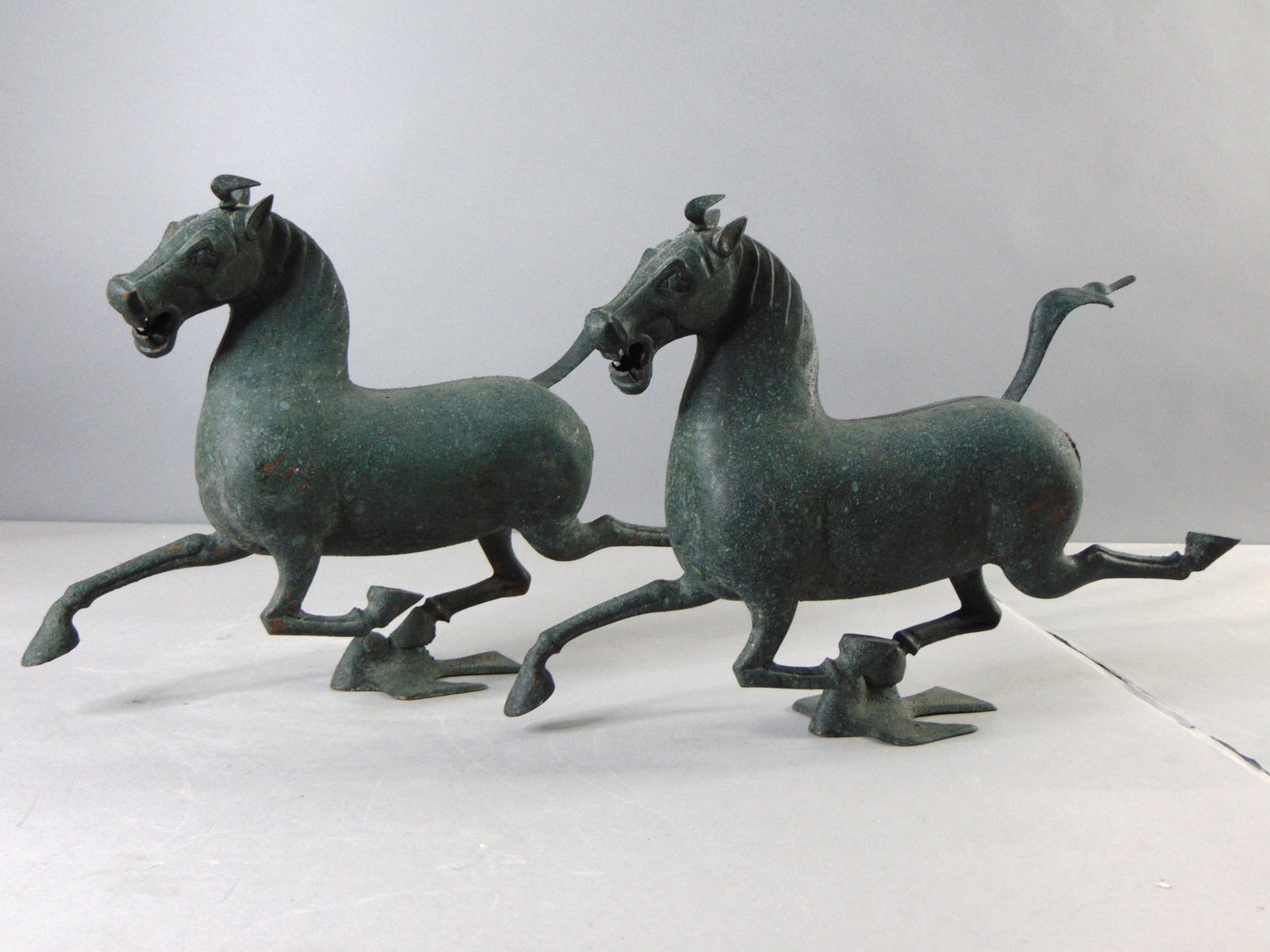 Pair of Vintage Chinese Copper Ming Style Horse Figure: A BEAUTIFUL PAIR OF VINTAGE CHINESE COPPER HORSE FIGURES OR STATUES THAT MEASURE 13" TALL BY 18 1/2" LONG BY 4" WIDE. HORSES HAVE BEEN OXIDUZED FOR DESIGN. HORSES HAVE BLEMISHES ALL AROUND AND ONE
