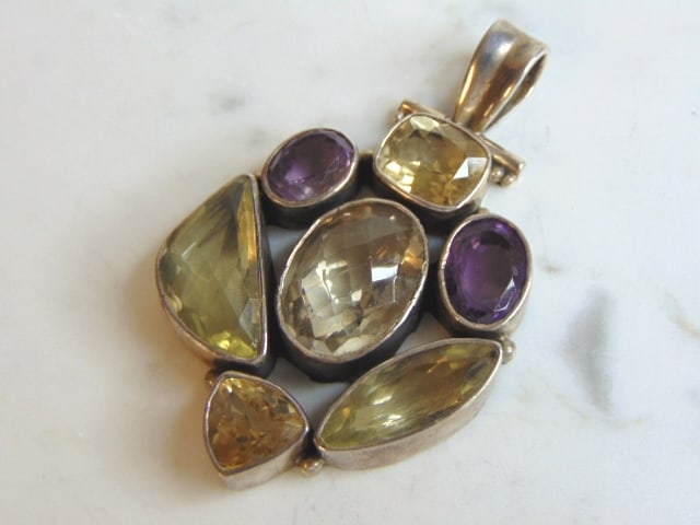 Womens Vintage Sterling Silver Multi Stone Pendant: A WOMENS VINTAGE ESTATE STERLING SILVER MULTI STONE PENDANT . NOT SURE IF STONES ARE REAL OR MAN MADE. PENDANT WEIGHS 37.1g AND PENDANT MEASURES 2 3/4" LONG BY 1 3/4" WIDE. MAKES A GREAT GIFT FOR THAT