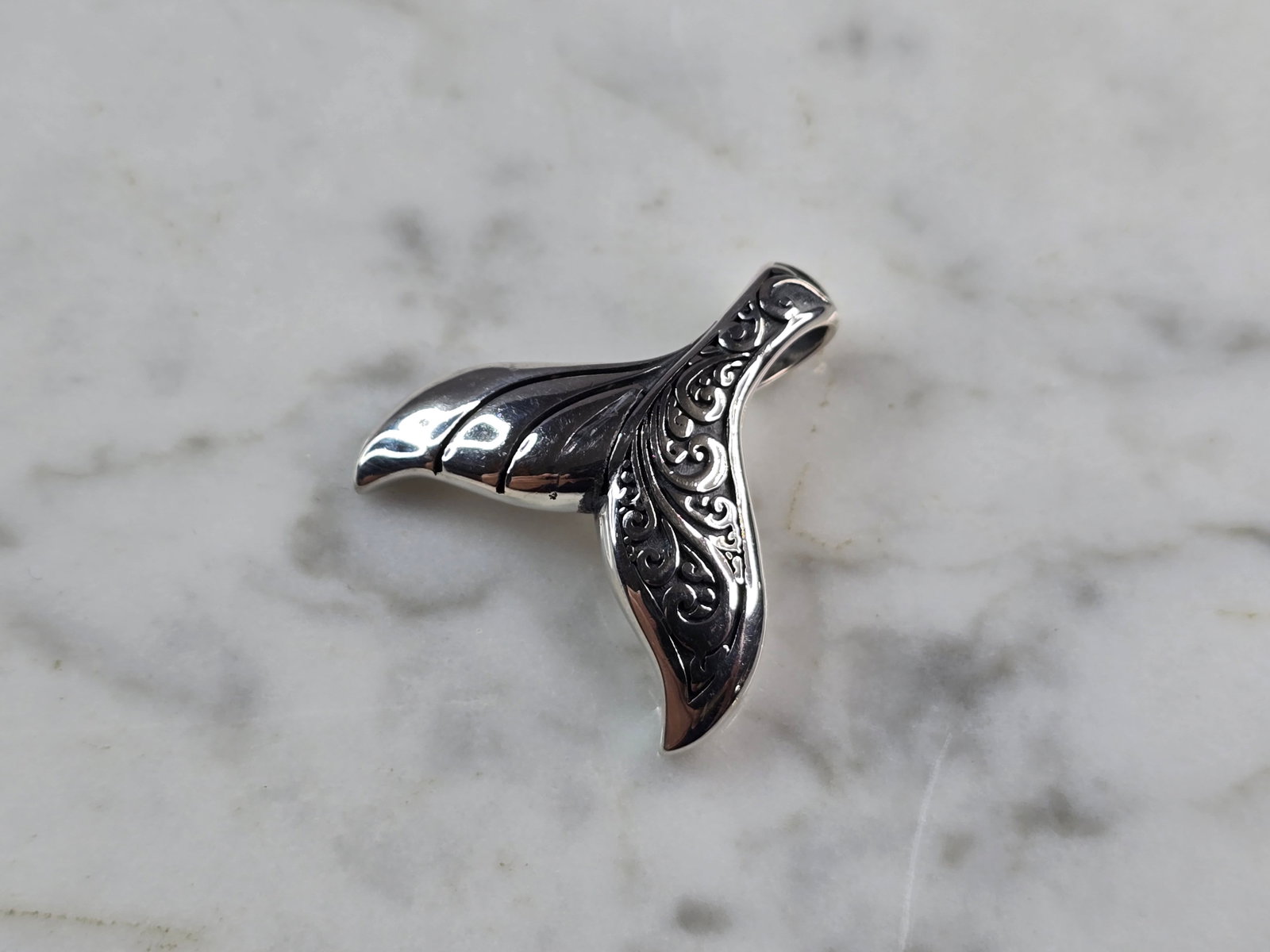 Womens Sterling Silver Modernist Whale Tail Pendant: A WOMENS STERLING SILVER MODERNIST WHALE TAIL PENDANT. THE PENDANT WEIGHS 8.2g AND MEASURES 1" LONG BY 1" WIDE. MAKES A GREAT GIFT FOR THAT SOMEONE SPECIAL. ANY QUESTIONS, PLEASE ASK. BE SURE TO CHECK