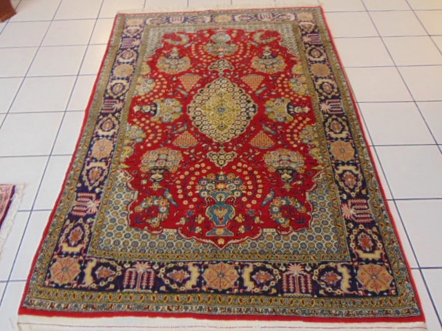 Vintage Estate Semi-Antique Handmade Tabriz Rug: A BEAUTIFUL SEMI ANTIQUE HANDMADE HAND KNOTTED TABRIZ RUG THAT MEASURES 4' 6" BY 6' 8" . RUG IS MADE FROM 100% WOOL. CONDITION IS GOOD. APPRAISED $7,500