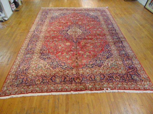 Vintage Estate Semi-Antique Handmade Kashan Rug: A BEAUTIFUL SEMI ANTIQUE HAND MADE HAND KNOTTED KASHAN RUG THAT MEASURES 13'7"BY 9'9". RUG IS MADE FROM 100% WOOL. CONDITION IS GOOD. APPRAISED $18,00