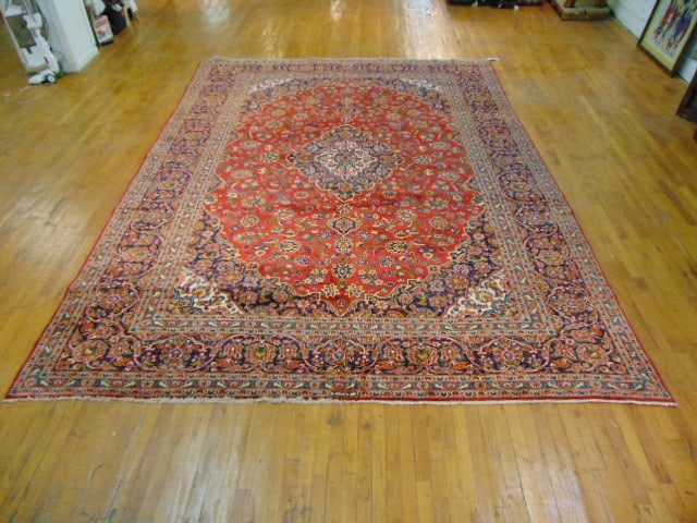 Vintage Estate Semi-Antique Handmade Kashan Rug: A BEAUTIFUL SEMI ANTIQUE HAND MADE HAND KNOTTED KASHAN RUG THAT MEASURES 13'2"BY 9'8". RUG IS MADE FROM 100% WOOL. CONDITION IS GOOD. APPRAISED $16,500.