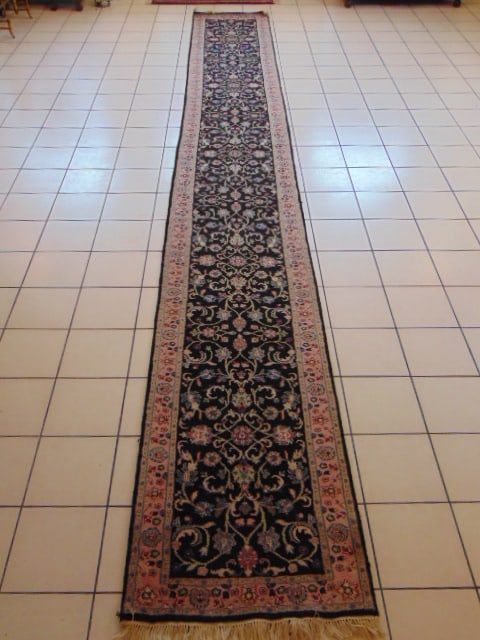 Vintage Estate Handmade Kashan Rug: A BEAUTIFUL VINTAGE ESTATE HANDMADE HANDKNOTTED KASHAN RUG THAT MEASURES 2' 7" BY 20' 1" . RUG IS MADE FROM 100% WOOL. CONDITION IS GOOD. APPRAISED $7500.
