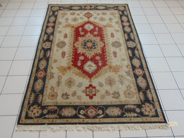 Vintage Estate Antique Handmade Indo Rug: A BEAUTIFUL VINTAGE ESTATE ANTIQUE HANDMADE HAND KNOTTED INDO RUG THAT MEASURES 5' 11" BY 9' . RUG IS MADE FROM 100% WOOL. APPRAISED $5500