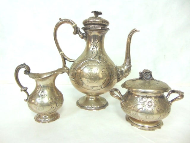 ANTIQUE VICTORIAN AESTHETIC GERMAN COIN SILVER TEA SET: A BEAUTIFUL ANTIQUE VICTORIAN AESTHETIC GERMAN COIN SILVER TEA SET THAT WAS MADE BY H. STEENAERTS. TOTAL WEIGHT OF THE SET IS 1568g. THE TEAPOT MEASURES 11" TALL BY 10" LONG. CONDITION IS GOOD FOR ITS