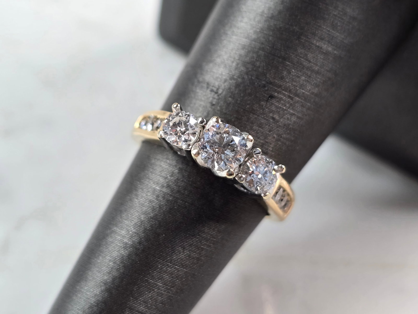 Womens Vintage Estate 14k Yellow Gold Diamond Ring: A WOMEN'S VINTAGE ESTATE 14K YELLOW GOLD DIAMOND RING. THE RING IS A SIZE 6.5 AND WEIGHS 4.3g. TOTAL CARAT WEIGHT OF DIAMONDS IN THE RING IS ABOUT .83cts. THE WIDTH OF THE RING IS ABOT 3/16". THE RING