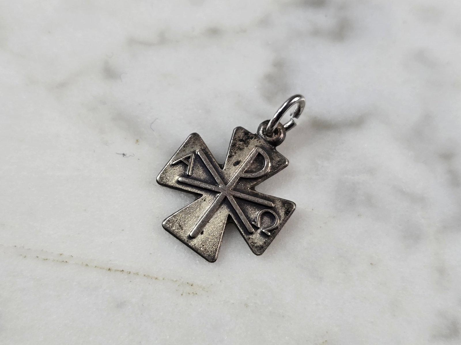 Womens Vintage Estate Sterling Silver Antaya Alpha Omega Cross Charm: A WOMEN'S VINTAGE ESTATE STERLING SILVER ANTAYA ALPHA OMEGA CROSS CHARM . CHARM MEASURES 3/4" LONG BY 1/2" WIDE AND WEIGHS 1.1g. MAKES A GREAT GIFT FOR THAT SOMEONE SPECIAL. ANY QUESTIONS, PLEASE ASK.