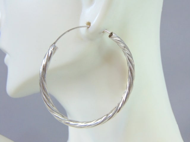 Womens Vintage Estate Sterling Silver Hoop Earrings: A PAIR OF WOMENS STERLING SILVER HOOP EARRINGS. EARRINGS WEIGH 6.3g AND MEASURES 1 3/4" IN DIAMETER. ANY OTHER QUESTIONS, PLEASE DO NOT HESITATE TO ASK. BE SURE TO CHECK OUT SOME OF MY OTHER GREAT ITE