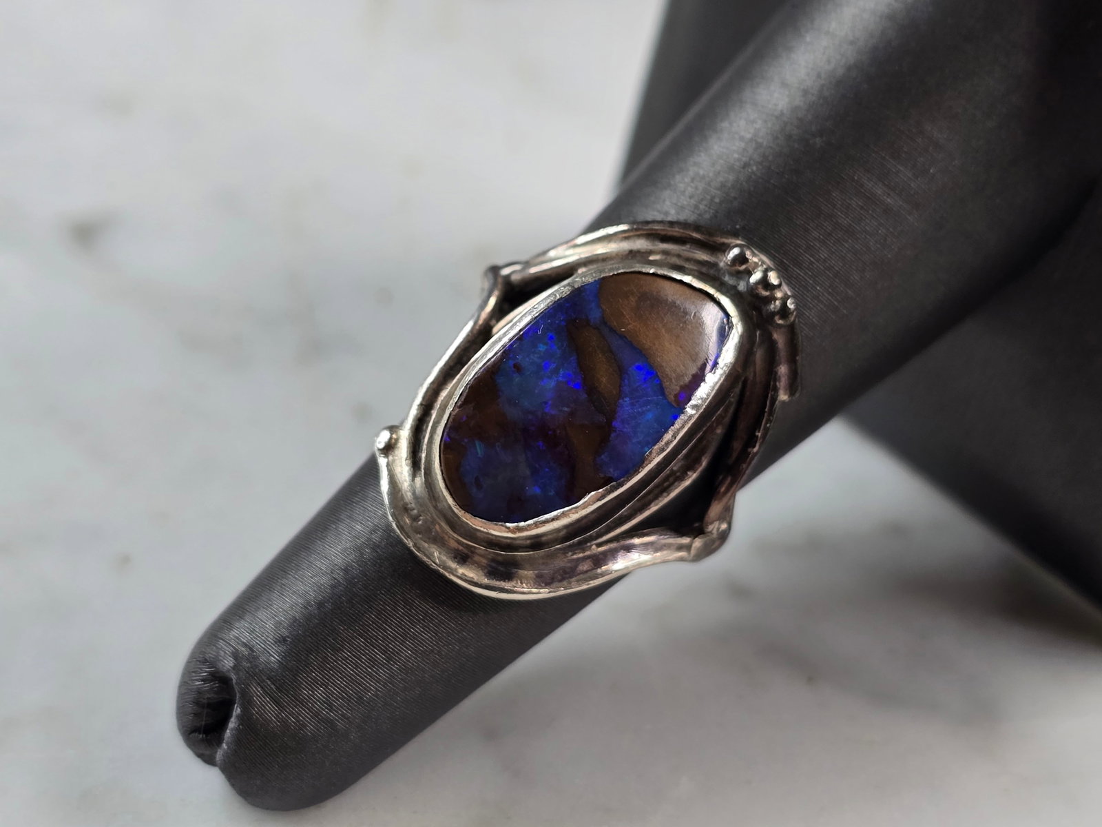 Womens Vintage Sterling Silver Southwest Boulder Blue Opal Ring: A WOMENS VINTAGE ESTATE STERLING SILVER SOUTHWESTERN BOULDER OPAL RING. THE RING SIZE IS A 7.0, AND WEIGHS 5.3g. THE LENGTH OF THE RING IS 1". NOT SURE IF THE STONE IS NATURAL OR MAN MADE. ANY QUESTIO