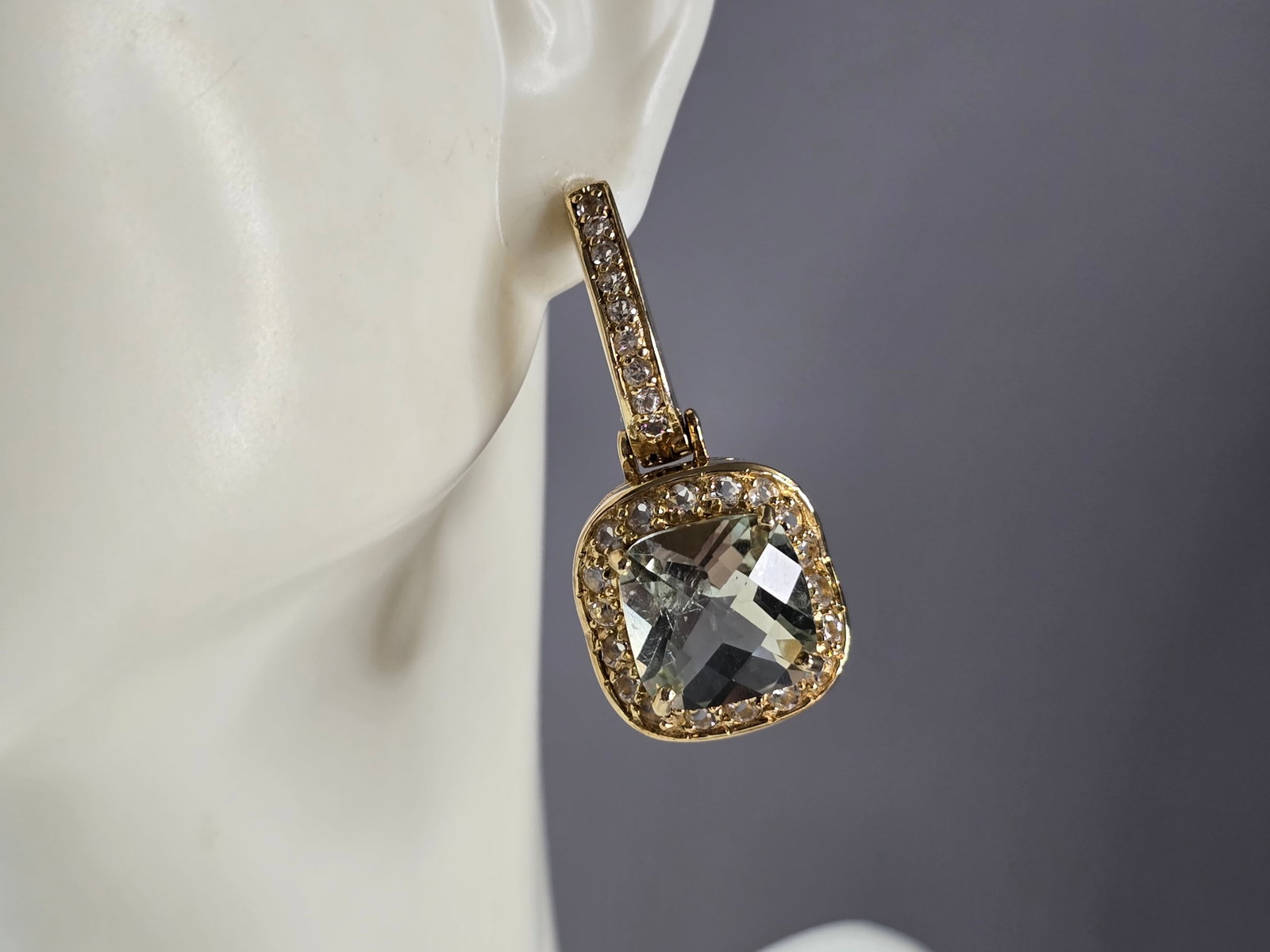 Womens Estate Sterling Silver Gold Tone Green Amethyst Earrings: A PAIR OF WOMENS VINTAGE ESTATE STERLING SILVER GOLD TONE GREEN AMETHYST COLORED EARRINGS. THE EARRINGS WEIGH 15.1g AND MEASURE 1 1/4" BY 5/8". NOT SURE IF STONES ARE NATURAL OR MAN MADE. ANY QUESTION