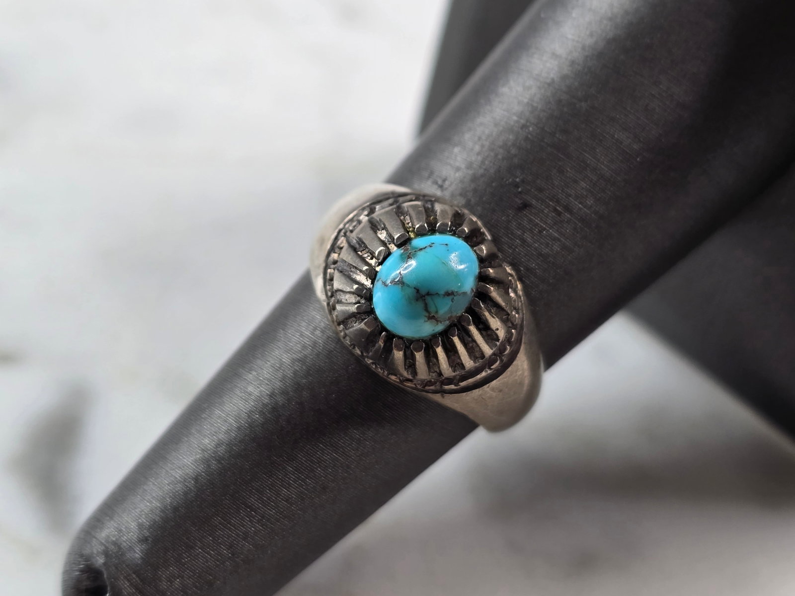Womens Vintage Estate Sterling Silver Southwestern Turquoise Ring: A WOMENS VINTAGE ESTATE STERLING SILVER SOUTHWESTERN TURQUOISE RING. THE RING SIZE IS A 7.0, AND WEIGHS 5.5g. THE WIDTH OF THE RING IS 3/8". NOT SURE IF STONE IS NATURAL OR MAN MADE. THERE IS A SMALL 