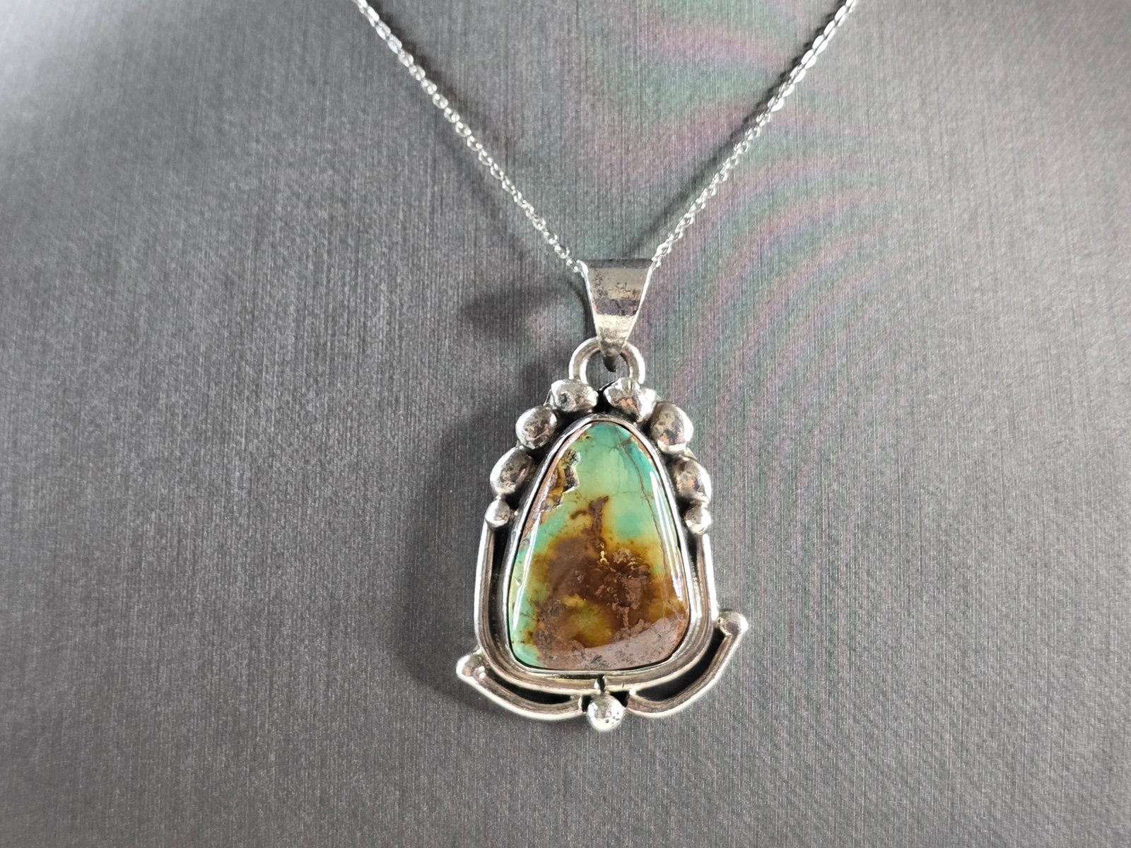 Womens Vintage Estate Sterling Silver Turquoise Pendant Necklace: A WOMENS VINTAGE ESTATE STERLING SILVER SOUTHWESTERN TURQUOISE STONE PENDANT WITH NECKLACE. THE PENDANT WITH THE NECKLACE WEIGHS 22.2g. THE PENDANT MEASURES 1 7/8" LONG BY 1 1/8" WIDE. THE NECKLACE ME