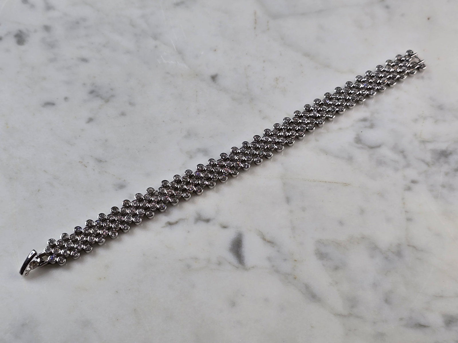 Womens Vintage Estate Sterling Silver Deco CZ Bracelet: A WOMENS VINTAGE ESTATE STERLING SILVER DECO CZ BRACELET. BRACELET MEASURES 7 5/8" LONG AND 1/2" WIDE AND WEIGHS 28.7g. WOULD MAKE A LOVELY GIFT FOR THAT SOMEONE SPECIAL. BE SURE TO CHECK OUT SOME OF 