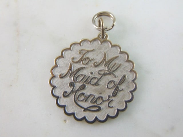 Womens Vintage Sterling Silver Maid of Honor Charm: FOR SALE IS THIS WOMENS VINTAGE ESTATE STERLING SILVER MAID OF HONOR CHARM. CHARM WEIGHS 3.9g AND MEASURES 1 3/8" LONG BY 1" WIDE. MAKES A GREAT GIFT FOR THAT SOMEONE SPECIAL. IF ANY QUESTIONS, PLEASE