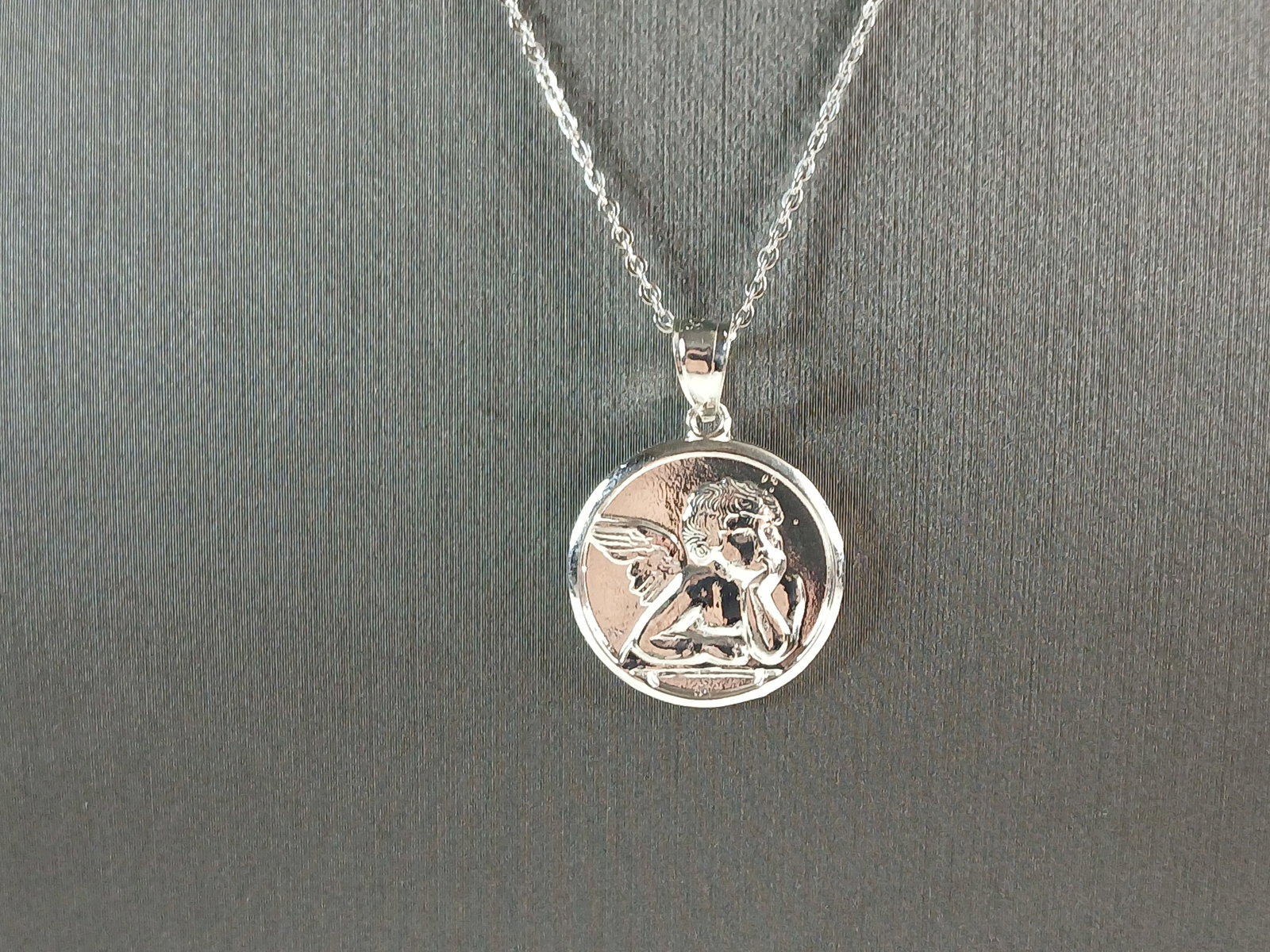 Womens Sterling Silver Guardian Angel Pendant Necklace: A WOMENS STERLING SILVER ANGEL PENDANT WITH NECKLACE. THE PENDANT WITH NECKLACE WEIGHS 4.2g. THE NECKLACE MEASURES 18" LONG AND IS ADJUSTABLE TO 16". THE PENDANT MEASURES 1" BY 3/4". MAKES A GREAT GIF