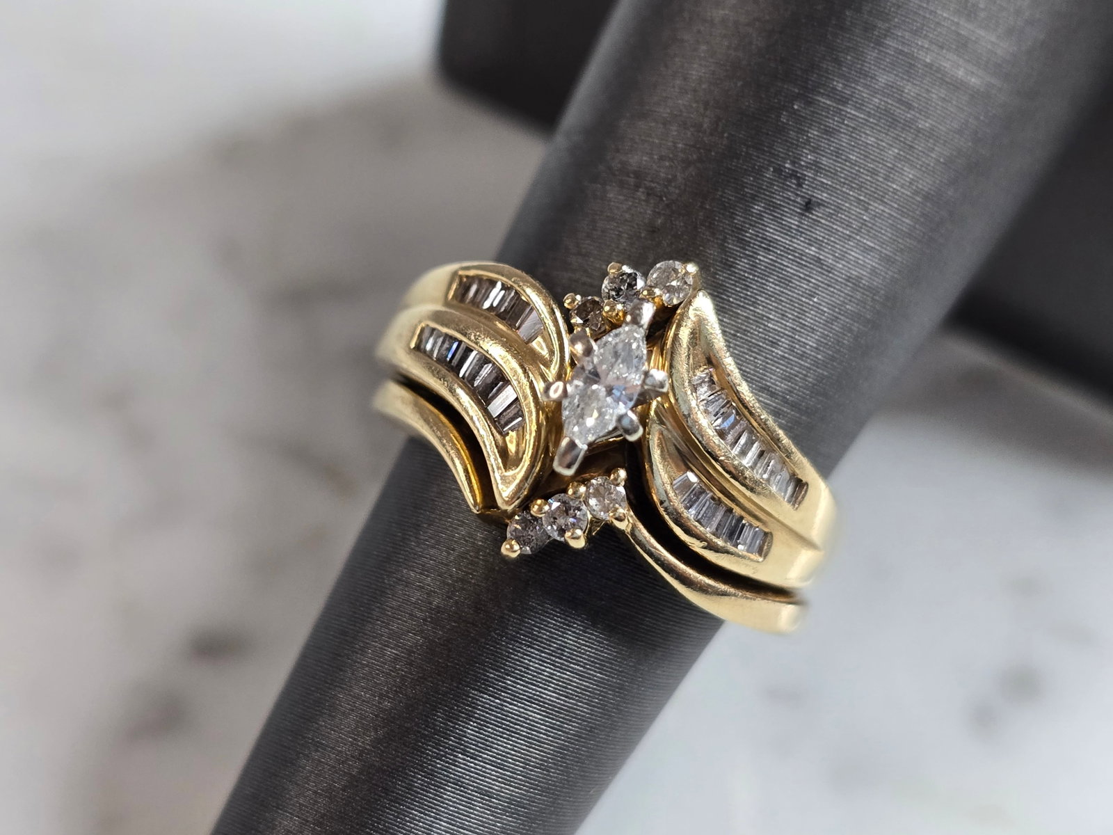Womens Vintage Estate 14k Yellow Gold Diamond Ring Set: A WOMENS VINTAGE ESTATE 14K YELLOW GOLD DIAMOND RING SET. THE RING IS A SIZE 6.5 AND WEIGHS 8.4g. TOTAL CARAT WEIGHT OF DIAMONDS IN THE RING IS ABOUT .57cts. THE WIDTH OF THE RING IS 1/2". THE RING MA