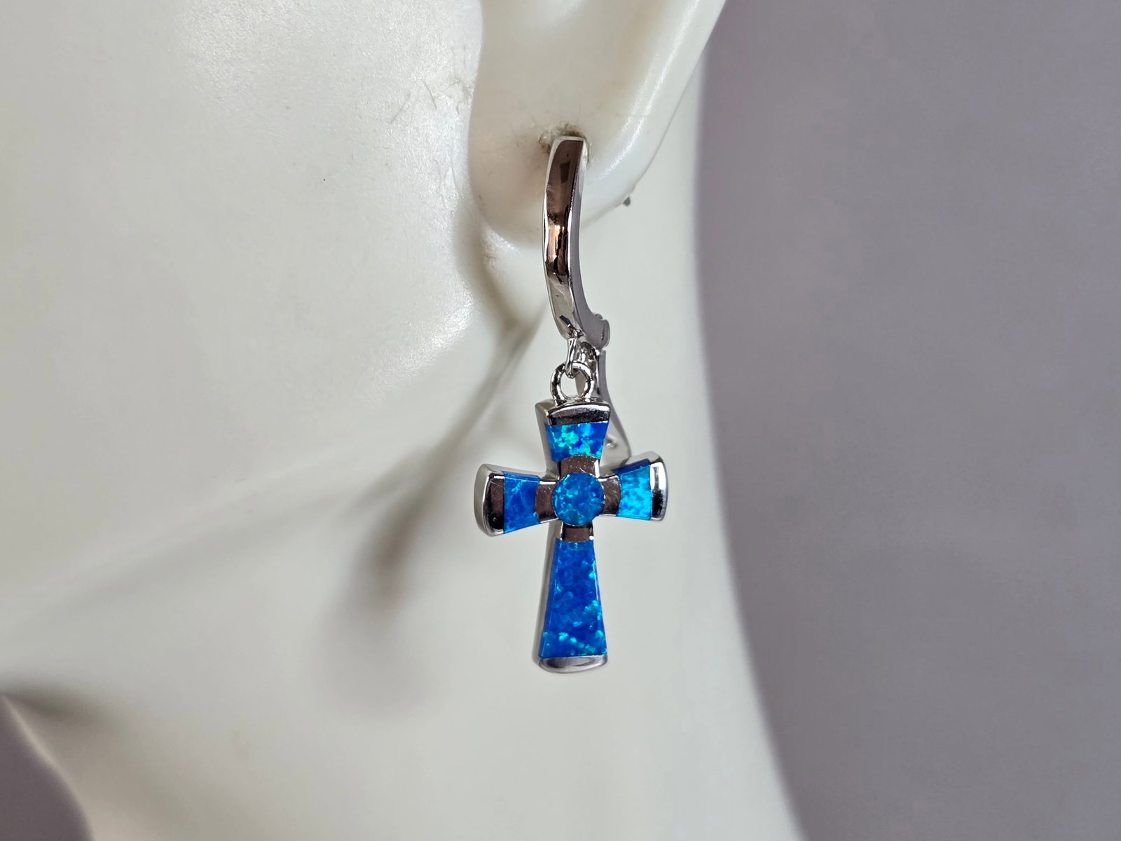 Womens Estate Sterling Silver Blue Opal Cross Earrings: A PAIR OF WOMENS STERLING SILVER BLUE OPAL COLORED CROSS EARRINGS THAT WEIGH 4.3g AND MEASURES 1 1/4" LONG BY 1/2" WIDE. NOT SURE IF STONES ARE REAL OR MAN MADE. ANY QUESTIONS, PLEASE DO NOT HESITATE 
