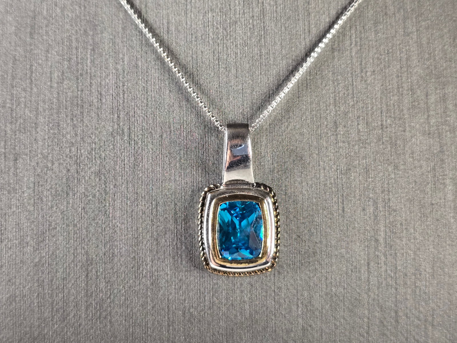 Womens Vintage Estate Sterling Silver Modernist Pendant Necklace: A WOMENS VINTAGE ESTATE STERLING SILVER AQUA OR TOPAZ COLORED MODERNIST PENDANT NECKLACE. NOT SURE IF THE STONE IS NATURAL OR MAN MADE. THE TOTAL WEIGHT IS 5.5g. NECKLACE IS 18" LONG, AND THE PENDANT 