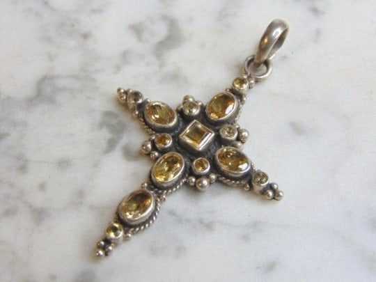 Womens Sterling Silver Smoky Quartz Cross Pendant: A WOMENS VINTAGE ESTATE STERLING SILVER SMOKY QUARTZ CROSS PENDANT. NOT SURE IF STONES ARE REAL OR MAN MADE. PENDANT WEIGHS 12.2g AND PENDANT MEASURES 2 3/4" LONG BY 1 3/4" WIDE. MAKES A GREAT GIFT FO
