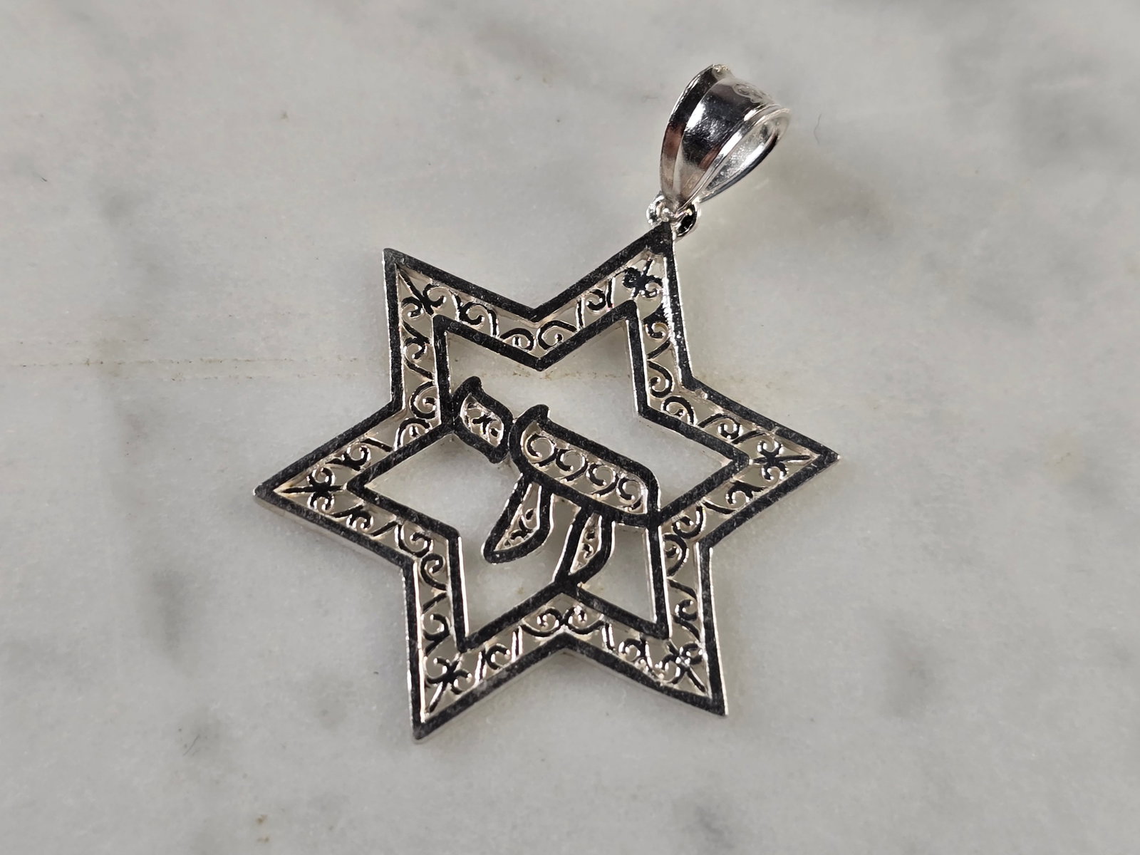 Sterling Silver Jewish Judaica Star of David Chai Pendant: A VINTAGE ESTATE STERLING SILVER STAR OF DAVID CHAI PENDANT. THE PENDANT WEIGHS 1.6g, AND MEASURES 1 1/4" LONG BY 7/8" WIDE. MAKES A GREAT GIFT FOR THAT SOMEONE SPECIAL. ANY QUESTIONS, PLEASE ASK. BE 