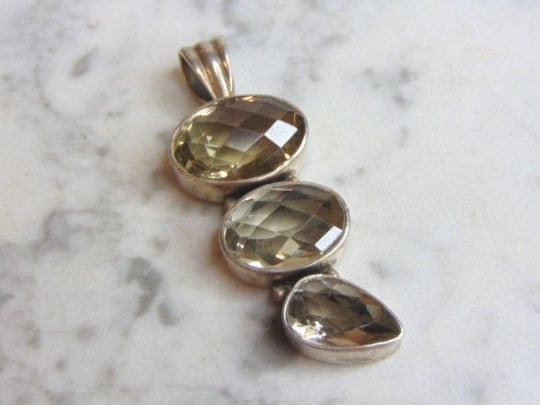 Womens Vintage Estate Sterling Silver CZ Stones Pendant: A WOMENS VINTAGE ESTATE STERLING SILVER CZ STONES PENDANT . NOT SURE IF STONES ARE REAL OR MAN MADE. PENDANT WEIGHS 25.3g AND PENDANT MEASURES 2 5/8" LONG BY 1" WIDE. MAKES A GREAT GIFT FOR THAT SOMEO