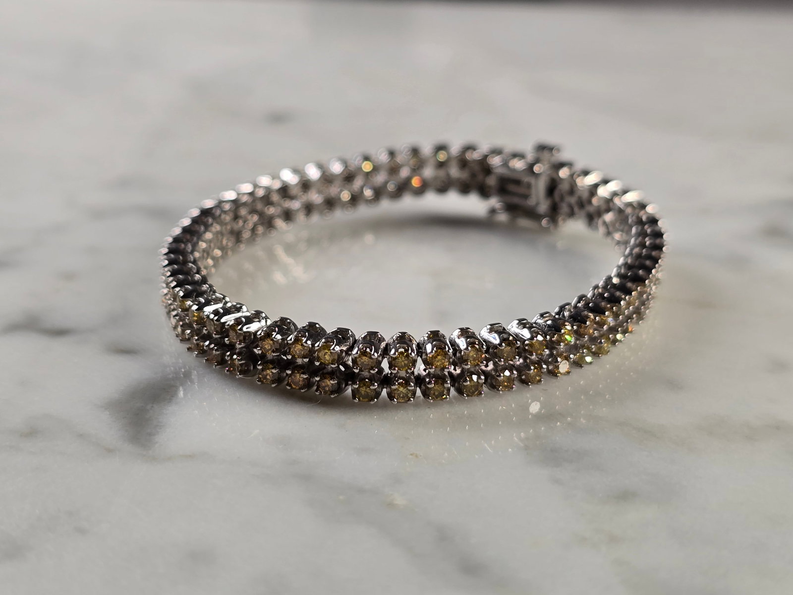 Womens Vintage Estate 14K Gold Yellow Diamond Bracelet: A WOMENS VINTAGE ESTATE 14K GOLD BRACELET WITH YELLOW DIAMONDS. THE BRACELET MEASURES 5 5/8" LONG BY ABOUT 1/4" WIDE. THE BRACELET WEIGHS 12.9g. THERE ARE 104 DIAMONDS IN THE BRACELET. ANY QUESTIONS P