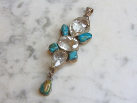 Womens Vintage Sterling Silver Turquoise Stone Pendant: A WOMENS VINTAGE ESTATE STERLING SILVER TURQUOISE STONE PENDANT . NOT SURE IF STONE IS REAL OR MAN MADE. PENDANT WEIGHS 17.4g AND PENDANT MEASURES 3 3/8" LONG BY 1" WIDE. MAKES A GREAT GIFT FOR THAT S
