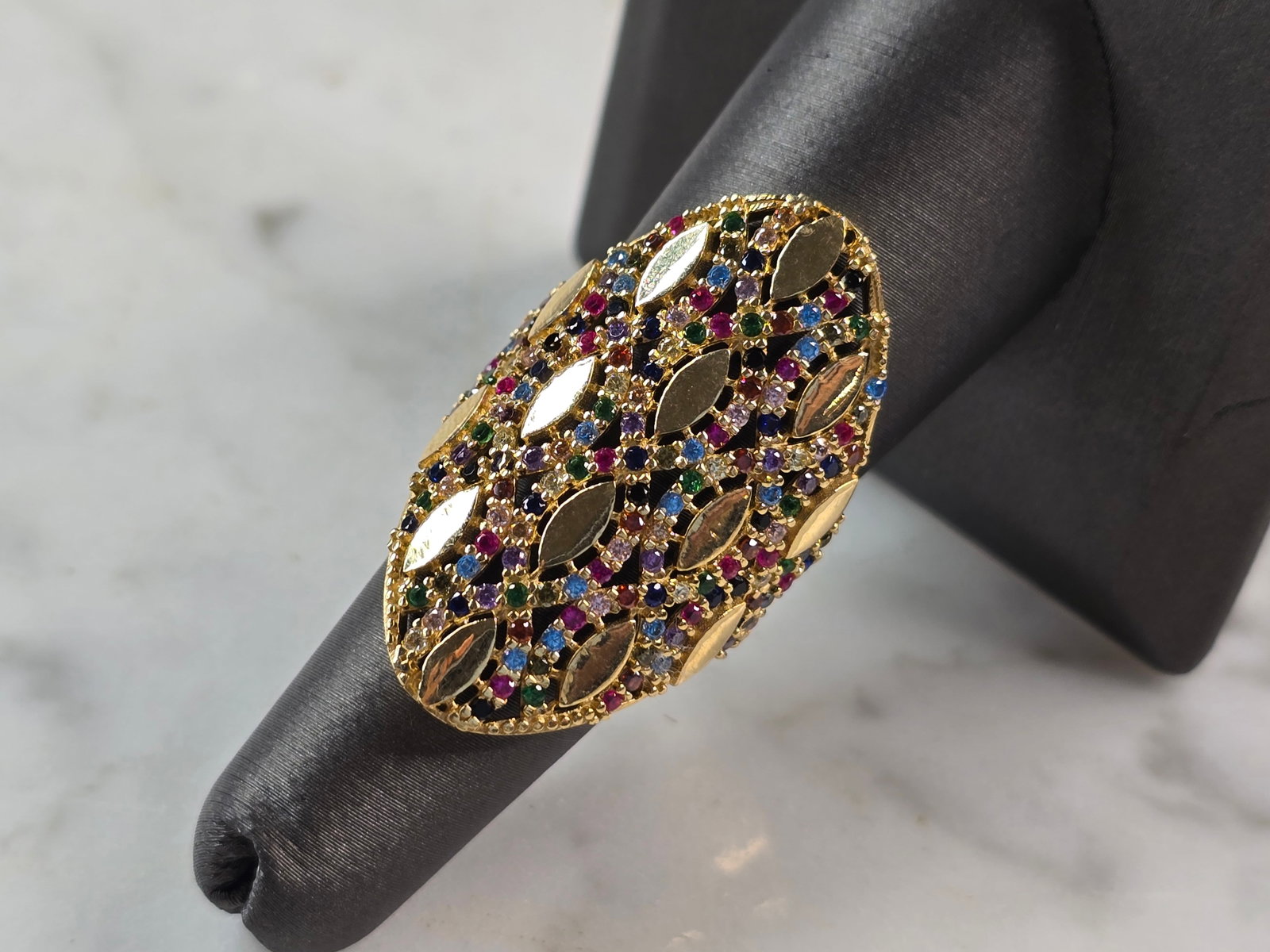 Womens 14k Yellow Gold Modernist Multi Stone Ring: A UNIQUE WOMENS 14K YELLOW GOLD MODERNIST RING WITH MULTI COLORED STONES. THE RING SIZE IS A 7.0, AND WEIGHS 6.4g. THE LENGTH OF THE RING IS 1 3/8". RING HAS A FAINT MARK ON THE INSIDE. STONES ARE MAN
