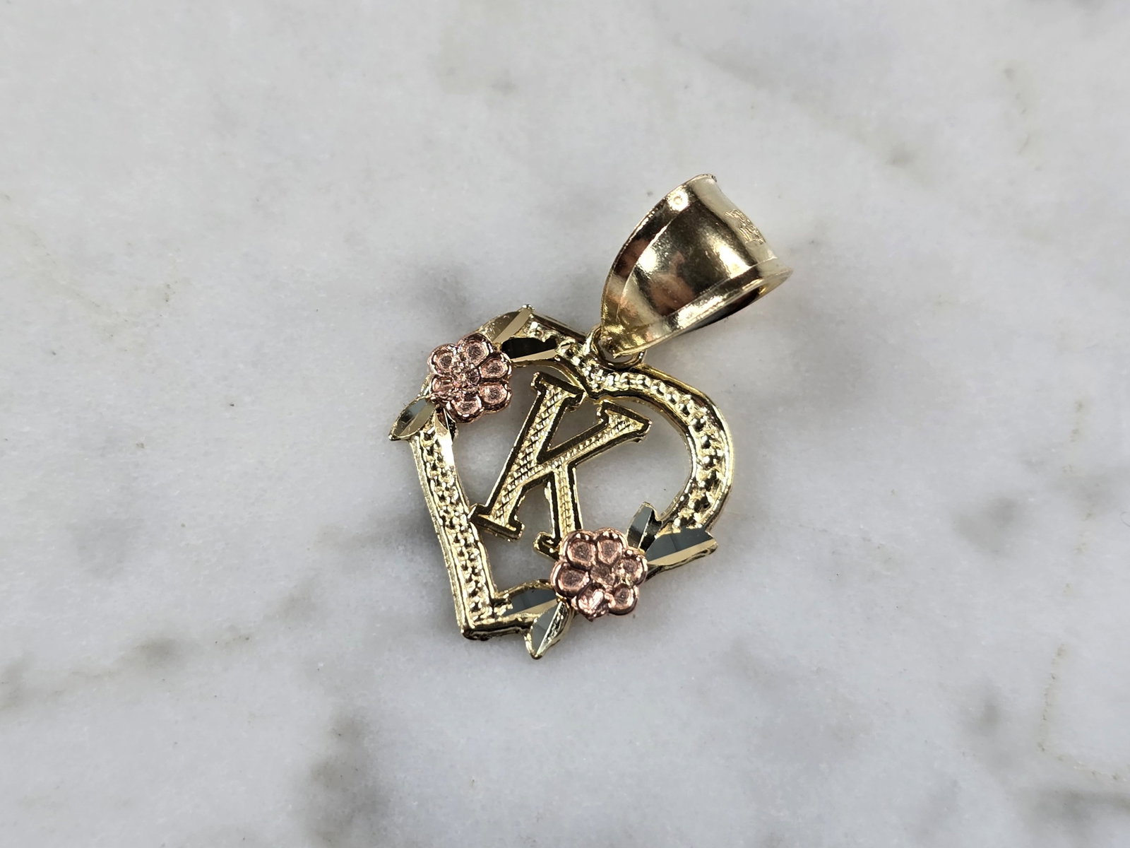 Womens 10K Yellow & Rose Gold Initial Letter " K " Heart Pendant: A WOMENS 10K YELLOW & ROSE GOLD "K" HEART PENDANT. PENDANT MEASURES 3/4" LONG BY 5/8" WIDE. TOTAL WEIGHT OF THE PENDANT IS 0.9g. WOULD MAKE A LOVELY GIFT FOR THAT SOMEONE SPECIAL. ANY QUESTIONS PLEASE