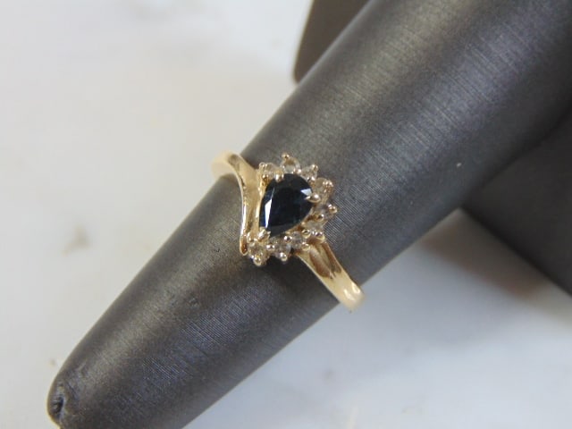 Womens Vintage 14K Gold Ring w/ Sapphire & Damonds: FOR SALE IS THIS WONDERFUL WOMENS 14K YELLOW GOLD RING WITH A BLUE SAPPHIRE STONE, ACCENTED BY ABOUT .27cts OF DIAMONDS. THE RING WEIGHS 3.1g. THE SIZE OF THE RING IS A 5.5. ANY QUESTIONS PLEASE DO NO