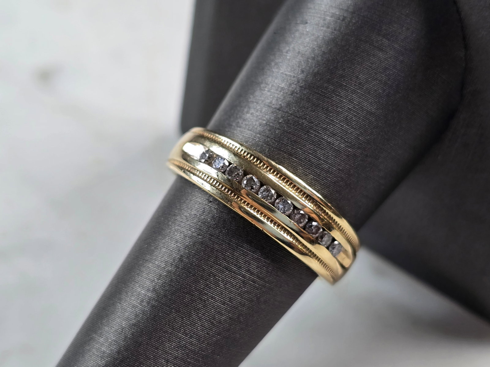 Womens Vintage Estate 10K Yellow Gold Diamond Ring: A MENS VINTAGE 10K YELLOW GOLD DIAMOND RING. THE SIZE OF THE RING IS A 9.0, AND WEIGHS 4.0g. THE WIDTH OF THE BAND IS 1/4". RING HAS 10 TINY DIAMONDS. RING IS STAMPED 10K. ANY QUESTIONS PLEASE DO NOT 
