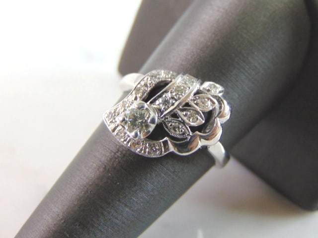 Womens Vintage Estate 14K White Gold Diamond Ring: FOR SALE IS THIS 14K WHITE GOLD DIAMOND RING WITH ABOUT .30cts OF DIAMONDS IN IT. THE RING WEIGHS 4.2g. THE SIZE OF THE RING IS A 9.0. THIS MAKES A LOVELY GIFT FOR THAT SOMEONE SPECIAL. ANY QUESTIONS 