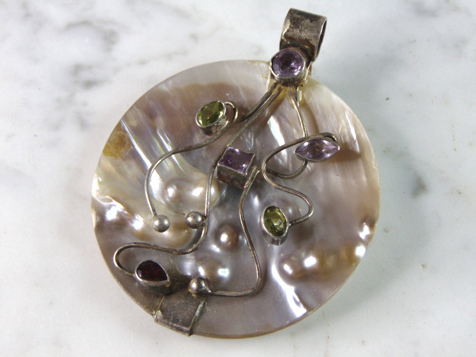 Womens Vintage Estate Sterling Silver Multi Stone MOP Pendant: FOR SALE IS THIS WOMENS VINTAGE ESTATE .925 STERLING SILVER MULTI STONE MOTHER OF PEARL PENDANT. PENDANT WEIGHS 29.1g AND PENDANT MEASURES 2 3/4" LONG BY 2 1/4" WIDE. MAKES A GREAT GIFT FOR THAT SOMEO
