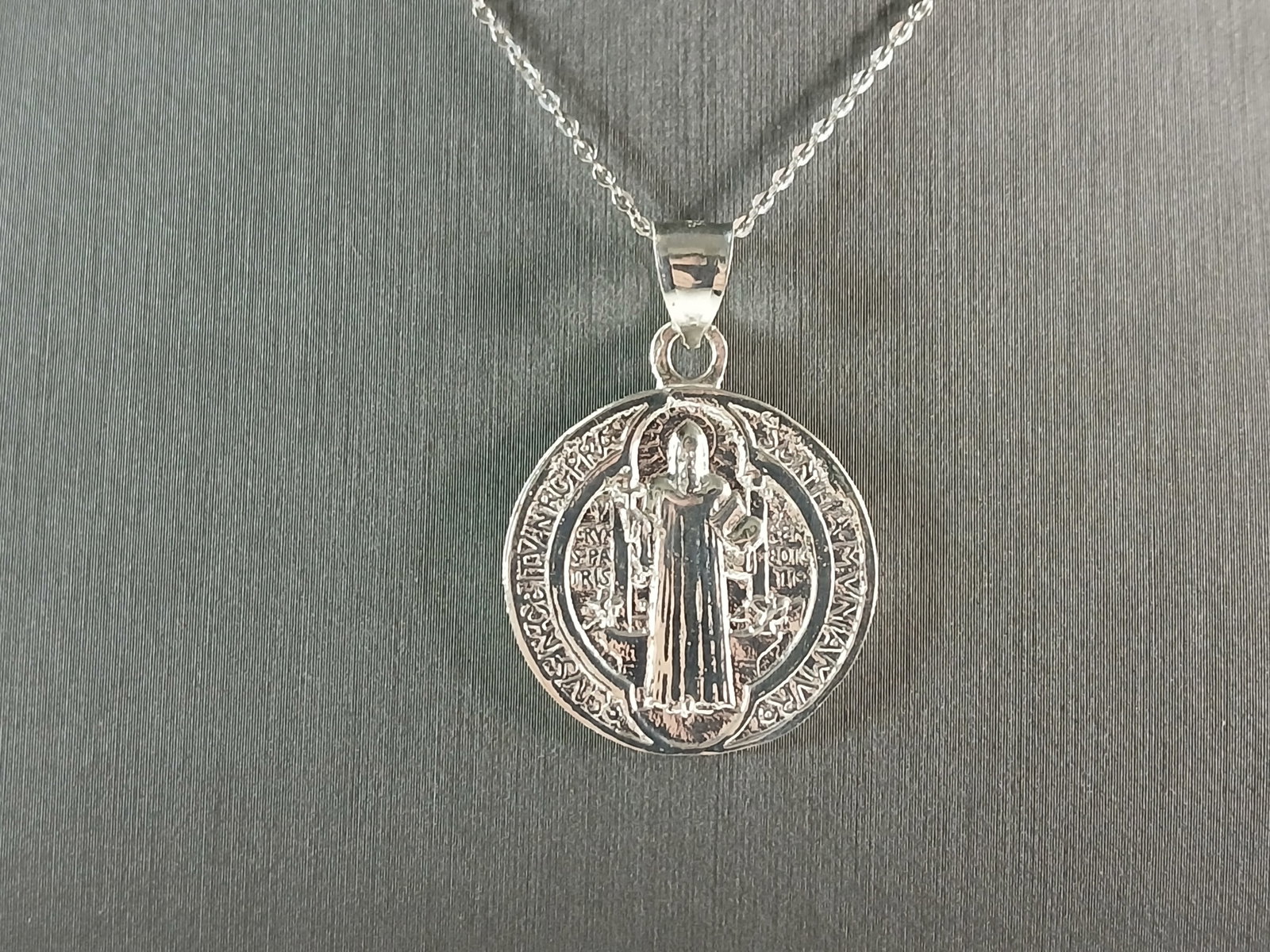 Womens Sterling Silver Religious St Benedict Cross Pendant Necklace: A WOMENS STERLING SILVER RELGIOUS ST. BENEDICT CROSS PENDANT WITH NECKLACE . THE TOTAL WEIGHT IS 7.5g. THE PENDANT MEASURES 1 1/4" LONG BY 1" WIDE. THE NECKLACE MEASURES 18" LONG AND IS ADJUSTABLE TO 