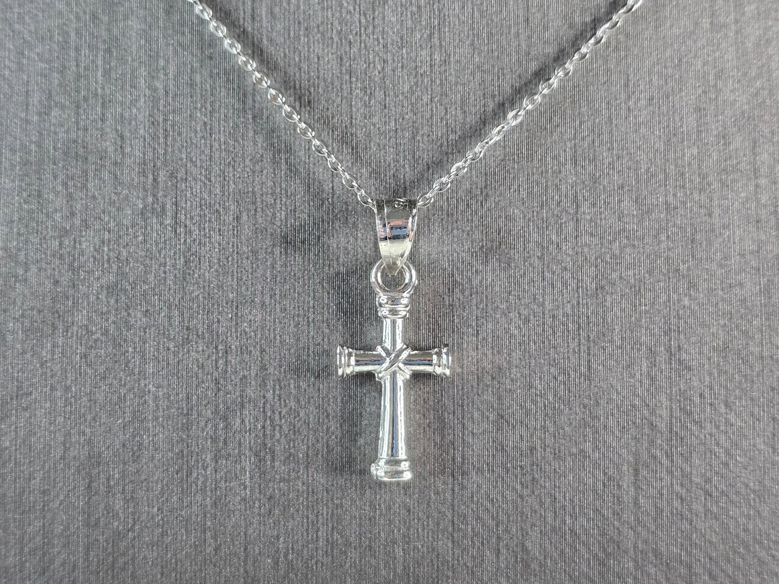 Womens Sterling Silver Religious Cross Necklace: A VERY NICE STERLING SILVER RELIGIOUS CROSS NECKLACE THAT WEIGHS 2.8g. THE NECKLACE MEASURES 18" LONG AND THE PENDANT MEASURES 7/8" LONG BY 3/8" WIDE. ANY QUESTIONS PLEASE DONT HESITATE TO ASK. BE SUR