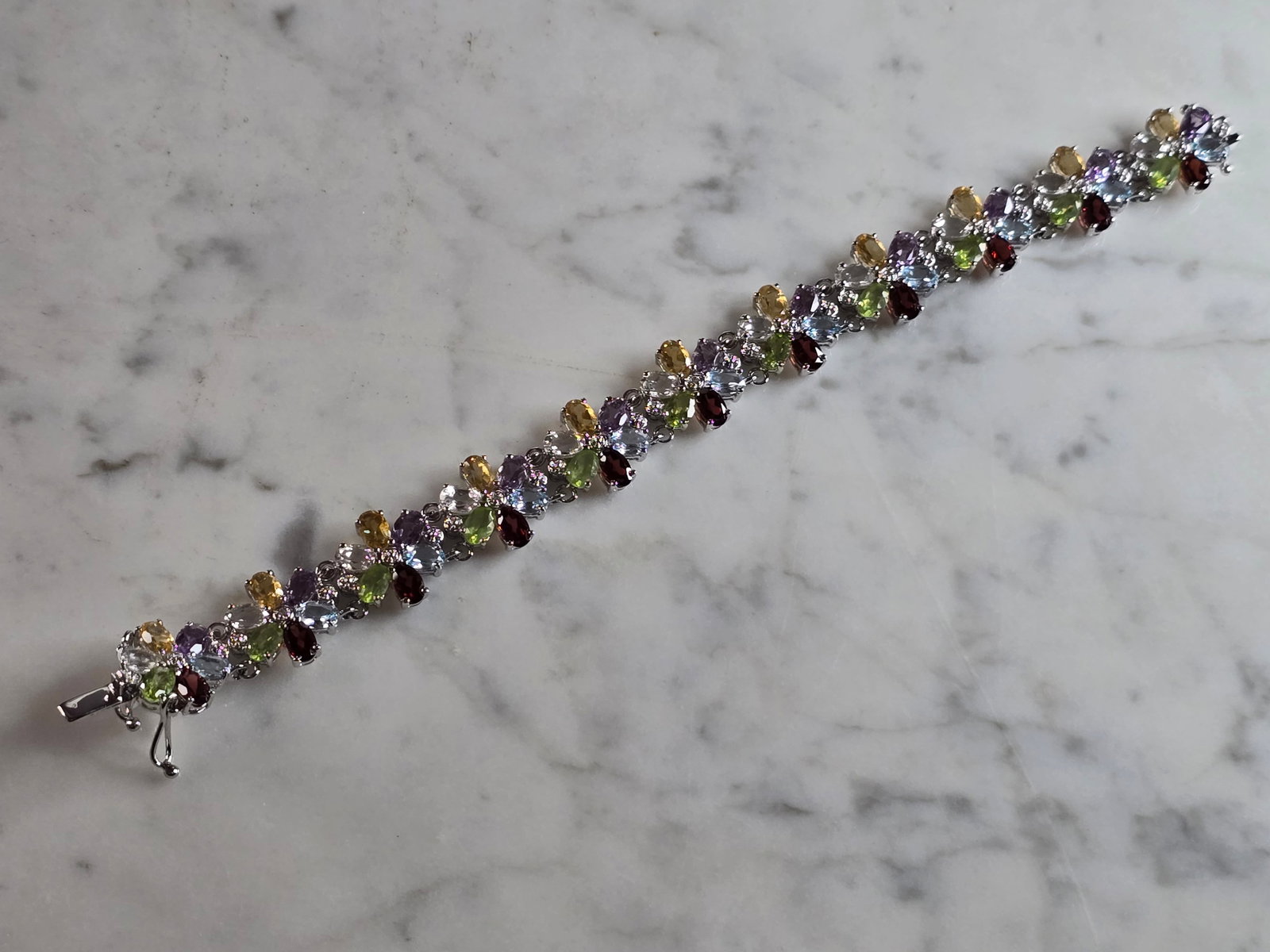 Womens Vintage Estate Sterling Silver Multi Stone Bracelet: A WOMENS VINTAGE ESTATE STERLING SILVER MULTI STONE BRACELET. BRACELET MEASURES 7 1/2" LONG BY 5/8" WIDE, AND WEIGHS 27.5g. NOT SURE IF STONES ARE NATURAL OR MAN MADE. ANY QUESTIONS, PLEASE DON'T HESI