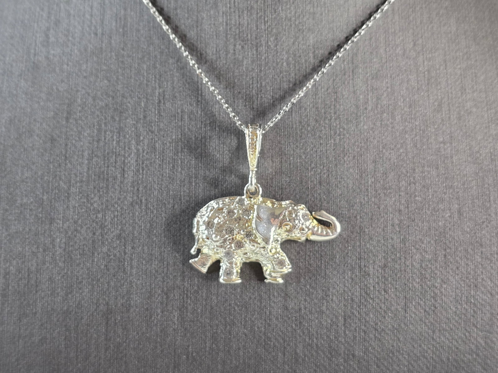 Womens Vintage Estate Sterling Silver CZ Elephant Pendant Necklace: A WOMENS VINTAGE ESTATE STERLING SILVER CZ ELEPHANT PENDANT WITH NECKLACE. THE PENDANT AND NECKLACE WEIGH 6.6g. THE NECKLACE MEASURES 18", AND IS ADJUSTABLE TO 16". THE PENDANT MEASURES 1 1/4" LONG BY