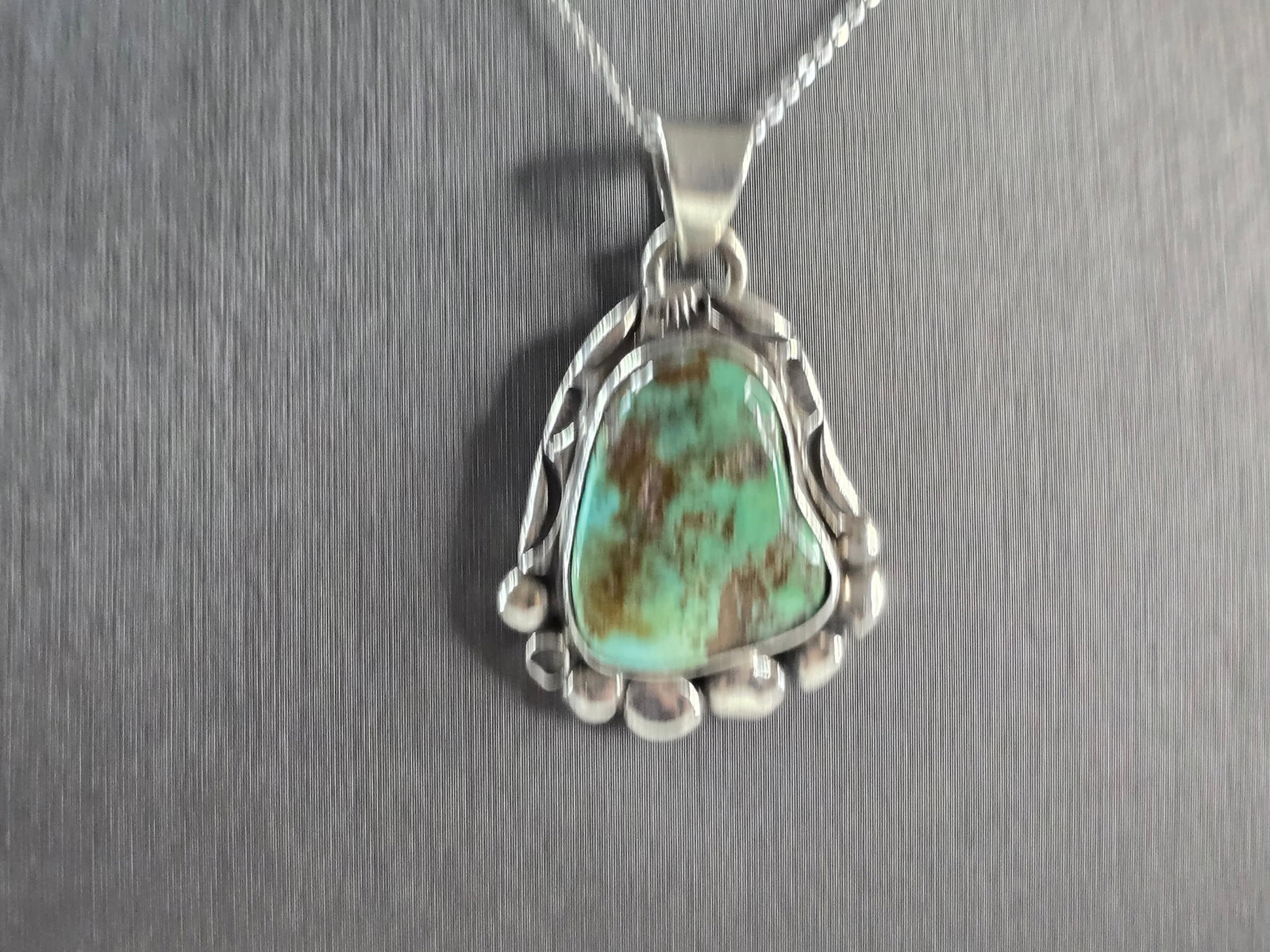 Womens Vintage Estate Sterling Silver Turquoise Pendant Necklace: A WOMENS VINTAGE ESTATE STERLING SILVER SOUTHWESTERN TURQUOISE STONE PENDANT WITH NECKLACE. THE PENDANT WITH THE NECKLACE WEIGHS 18.9g. THE PENDANT MEASURES 1 3/4" LONG BY 1 1/8" WIDE. THE NECKLACE ME
