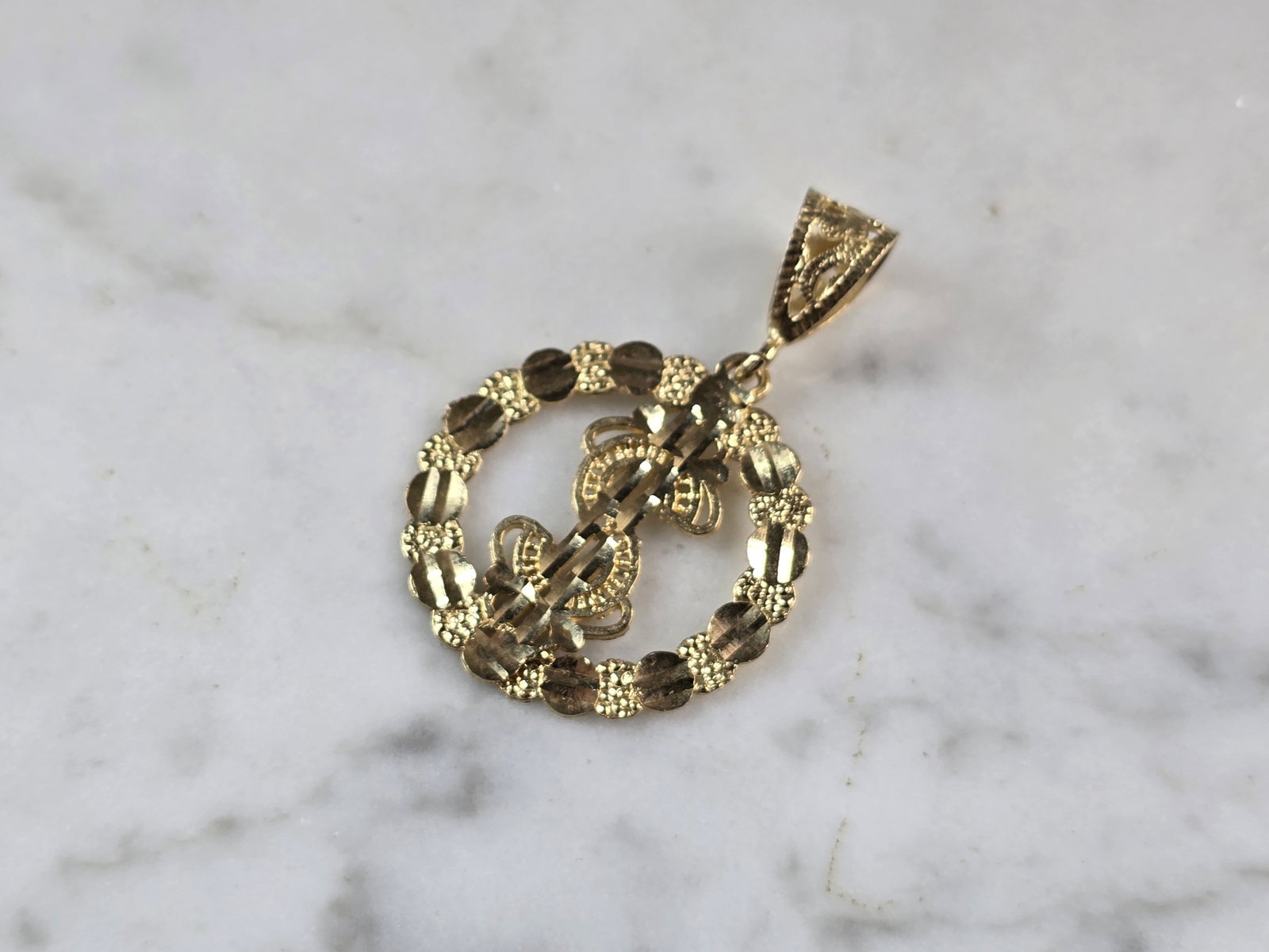 Vintage Estate 10K Yellow Gold Money Sign Pendant: A VINTAGE ESTATE 10K YELLOW GOLD MONEY SIGN PENDANT. THE PENDANT MEASURES 1 1/2" BY 1", AND WEIGHS 1.9g. PENDANT DOES HAVE A SPLIT AT THE BOTTOM BUT IT DOESNT AFFECT IT . HARD TO TELL UNLESS YOU ARE R