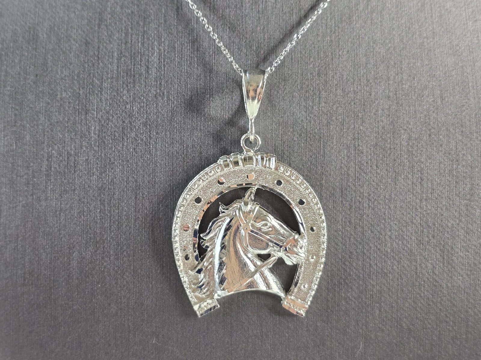 Women Vintage Sterling Silver Lucky Horseshoe Pendant Necklace: A WOMENS VINTAGE ESTATE STERLING SILVER LUCKY HORSESHOE PENDANT WITH NECKLACE THAT WEIGHS 11.1g. THE PENDANT MEASURES 2 1/8" BY 1 3/8" LONG. THE NECKLACE MEASURES 18", AND IS ADJUSTABLE TO 16". MAKES 