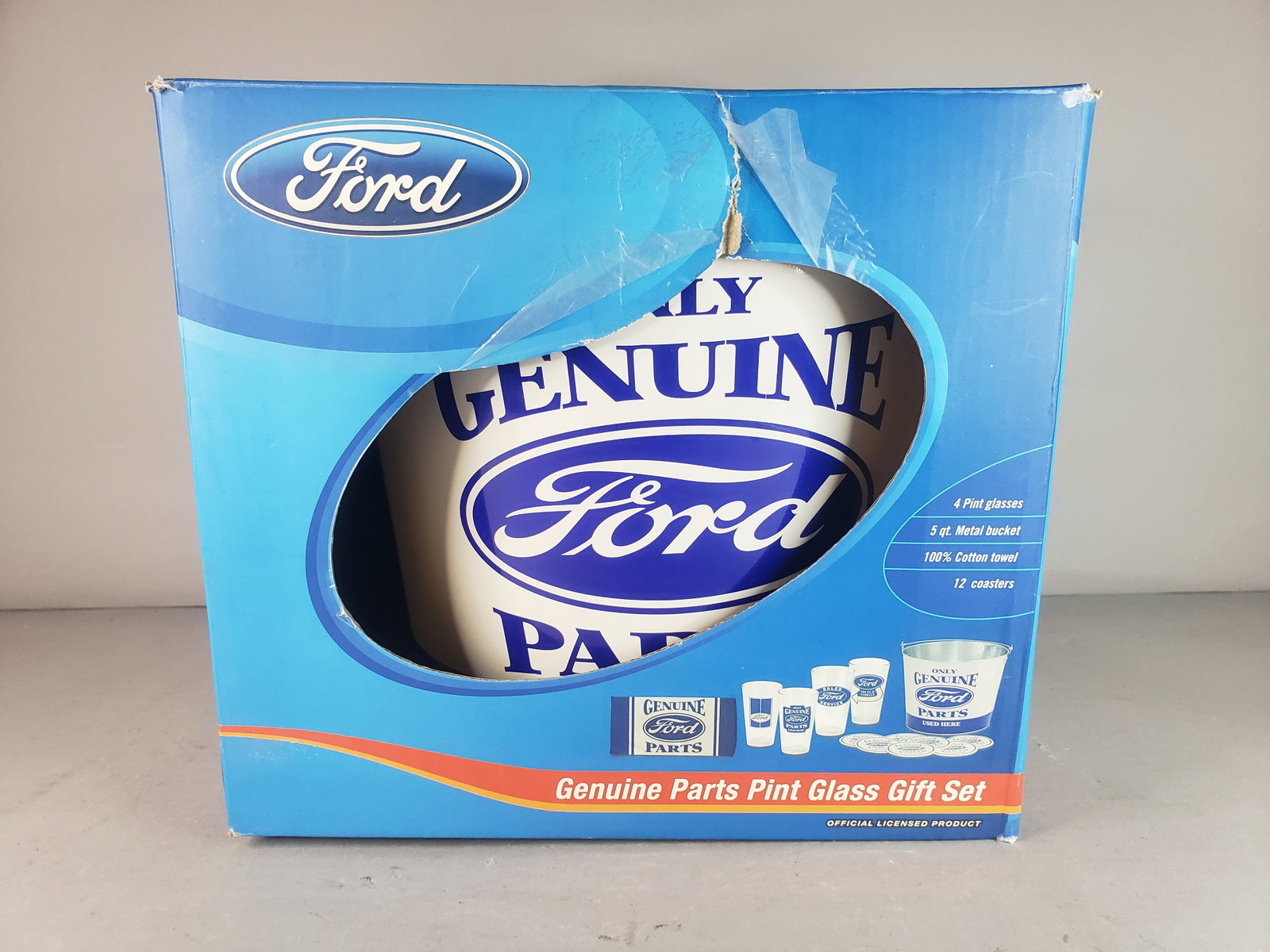 Genuine Ford Parts 4 Tumbler Pint Glass Coaster Bar Rag 10pc Gift Set: A GENUINE FORD PARTS 4 TUMBLER PINT GLASS COASTER BAR RAG 10PC GIFT SET. BOX HAS BEEN OPENED AND HAS SOME BLEMISHES AND ONLY HAS 4 COASTERS AS SEEN IN THE PICTURES, WOULD BE BUYING AS IS. MAKES A GREA