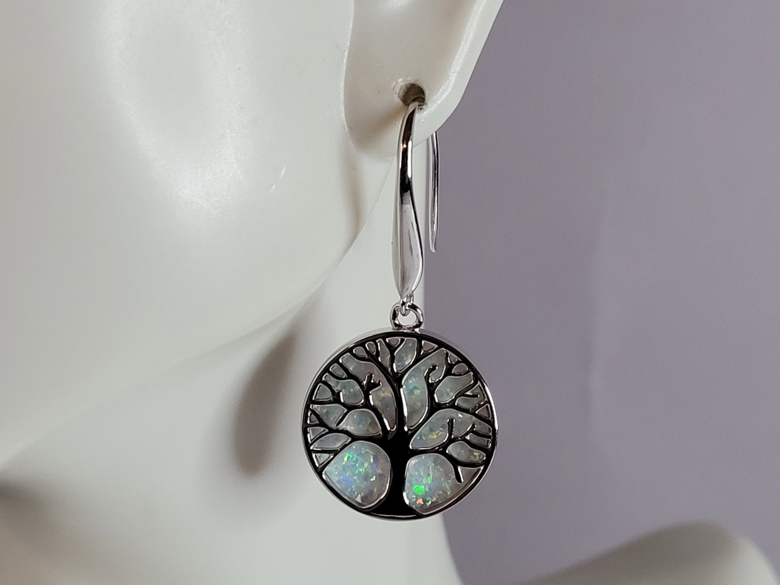 Womens Sterling Silver Opal Tree of Life Earrings: A WOMENS ESTATE STERLING SILVER OPAL TREE OF LIFE EARRINGS. NOT SURE IF STONES ARE REAL OR MAN MADE. THE EARRINGS WEIGH 6.9g AND MEASURES 1 1/2" LONG BY 3/4" WIDE. MAKES A GREAT GIFT FOR THAT SOMEONE 