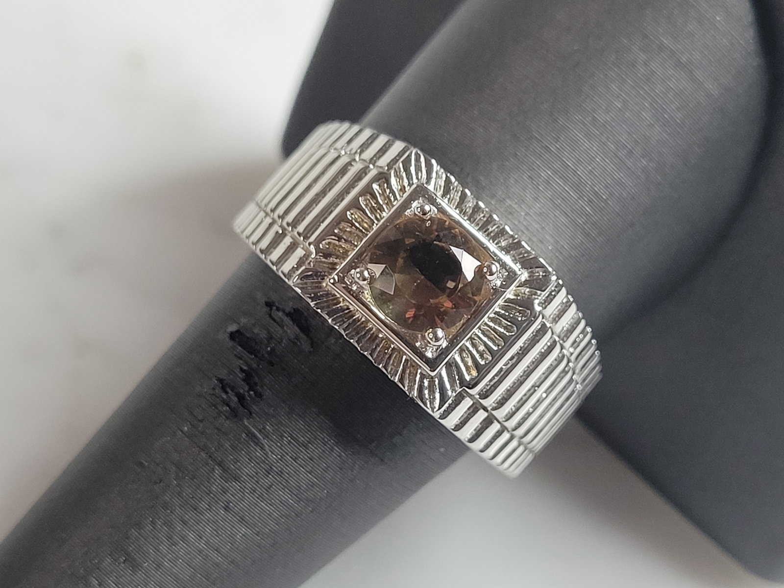 Mens Estate Sterling Silver Modernist Citrine Ring: A MENS ESTATE STERLING SILVER MODERNIST RING. THE RING IS A SIZE 10.0 AND WEIGHS 10.0g. STONE IS A CITRINE COLORED GLASS. WIDTH OF THE RING IS ABOUT 7/16". THE RING MAKES A BEAUTIFUL, IMPRESSIVE GIFT 