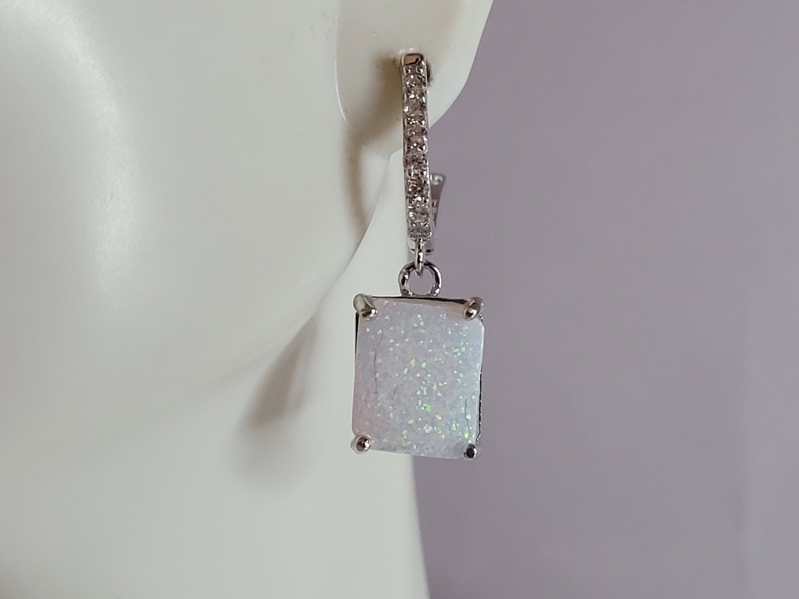 Womens Estate Sterling Silver Modernist Opal Earrings: A PAIR OF WOMENS STERLING SILVER OPAL COLORED EARRINGS THAT WEIGH 4.5g AND MEASURES 1 1/8" LONG BY 3/8" WIDE. NOT SURE IF STONES ARE REAL OR MAN MADE. ANY QUESTIONS, PLEASE DO NOT HESITATE TO ASK. BE 
