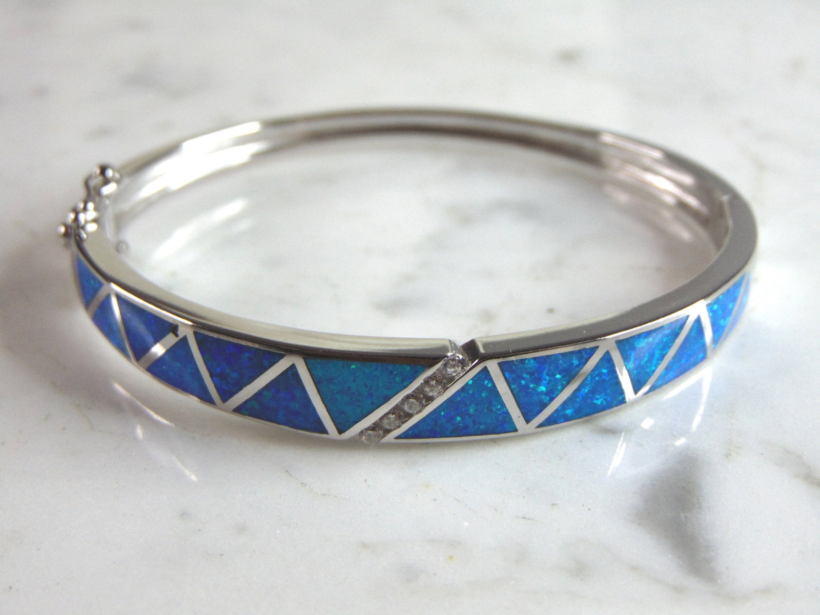 Womens Sterling Silver Modernist Opal Bangle Bracelet: A WOMENS STERLING SILVER MODERNIST OPAL BANGLE BRACELET. THE BRACELET WEIGHS 18.2g AND IS ABOUT 3/8" WIDE. THE CIRCUMFERENCE WITH THE GAP IS 6 1/2". ANY QUESTIONS PLEASE DO NOT HESITATE TO ASK. BE SUR