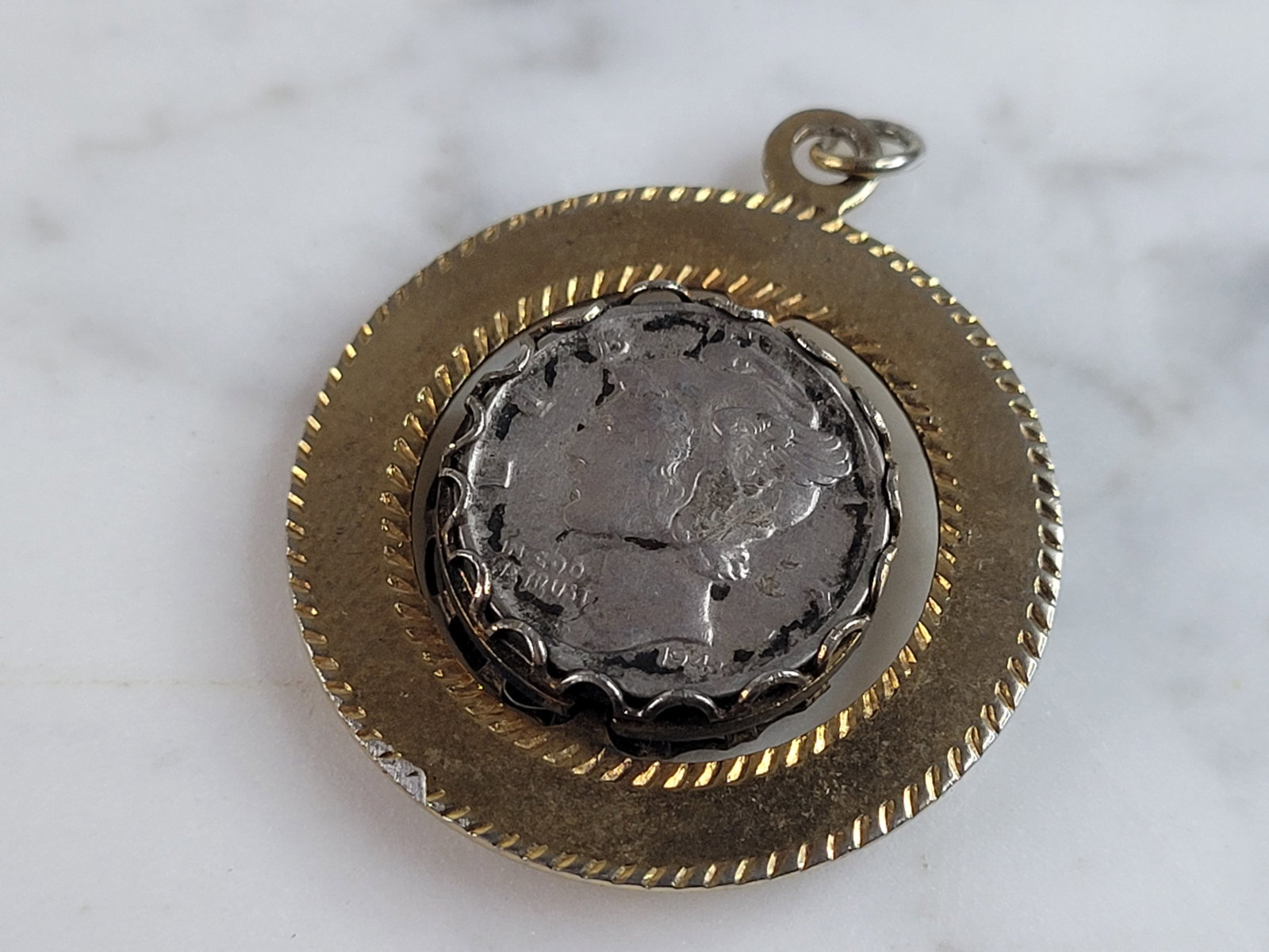 Womens Vintage Estate Silver Mercury Roosevelt Dime Coin Pendant: A WOMENS VINTAGE ESTATE MERCURY & ROOSEVELT SILVER DIME COIN PENDANT. PENDANT WEIGHS 12.7g AND MEASURES 1 1/4". THE BEZEL IS NOT STERLING. THE MERCURY DIME IS FROM 1943, AND THE ROOSEVELT IS FROM 1964